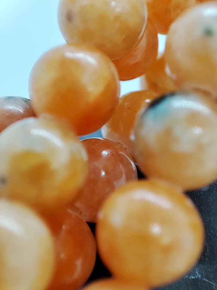 Fil de perles de calcite orange 6mm